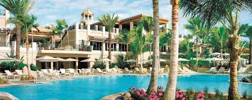 Palm-lined resort courtyard and pool in Sarasota, Florida